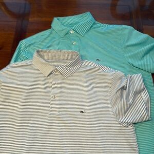 Two Vineyard Vines performance material short sleeve collared shirt.